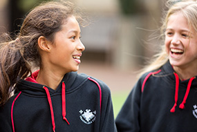 School girls laughing